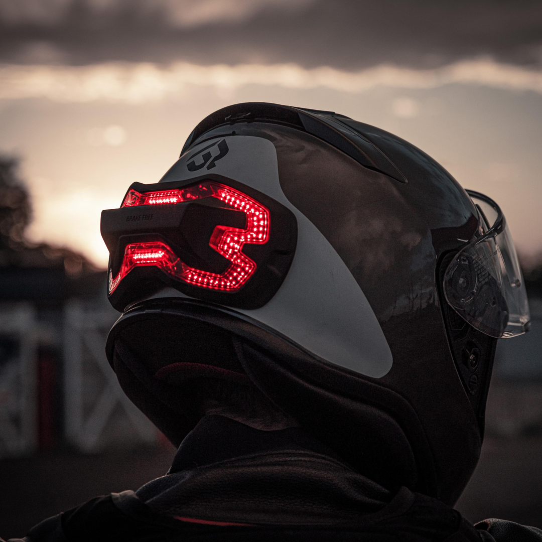 Brake Free on a Shoei RF1200 helmet. Autonomous brake light accessory for motorcycle helmets. High visibility. 